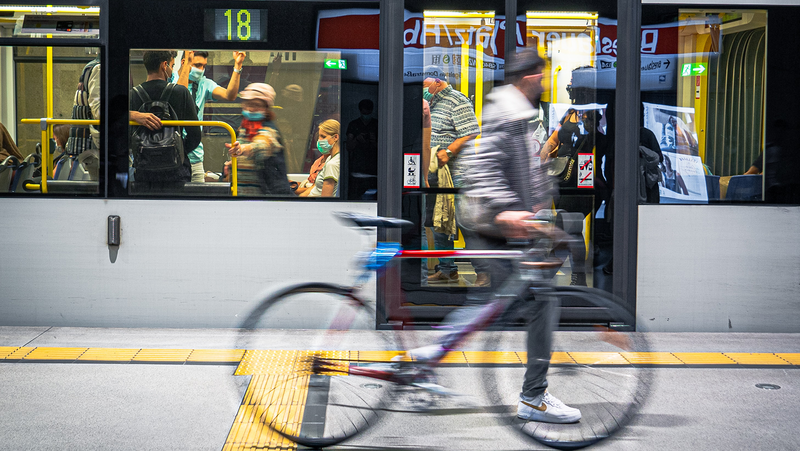 Public transport and a bike. Photo: Mika Baumeister on Unsplash